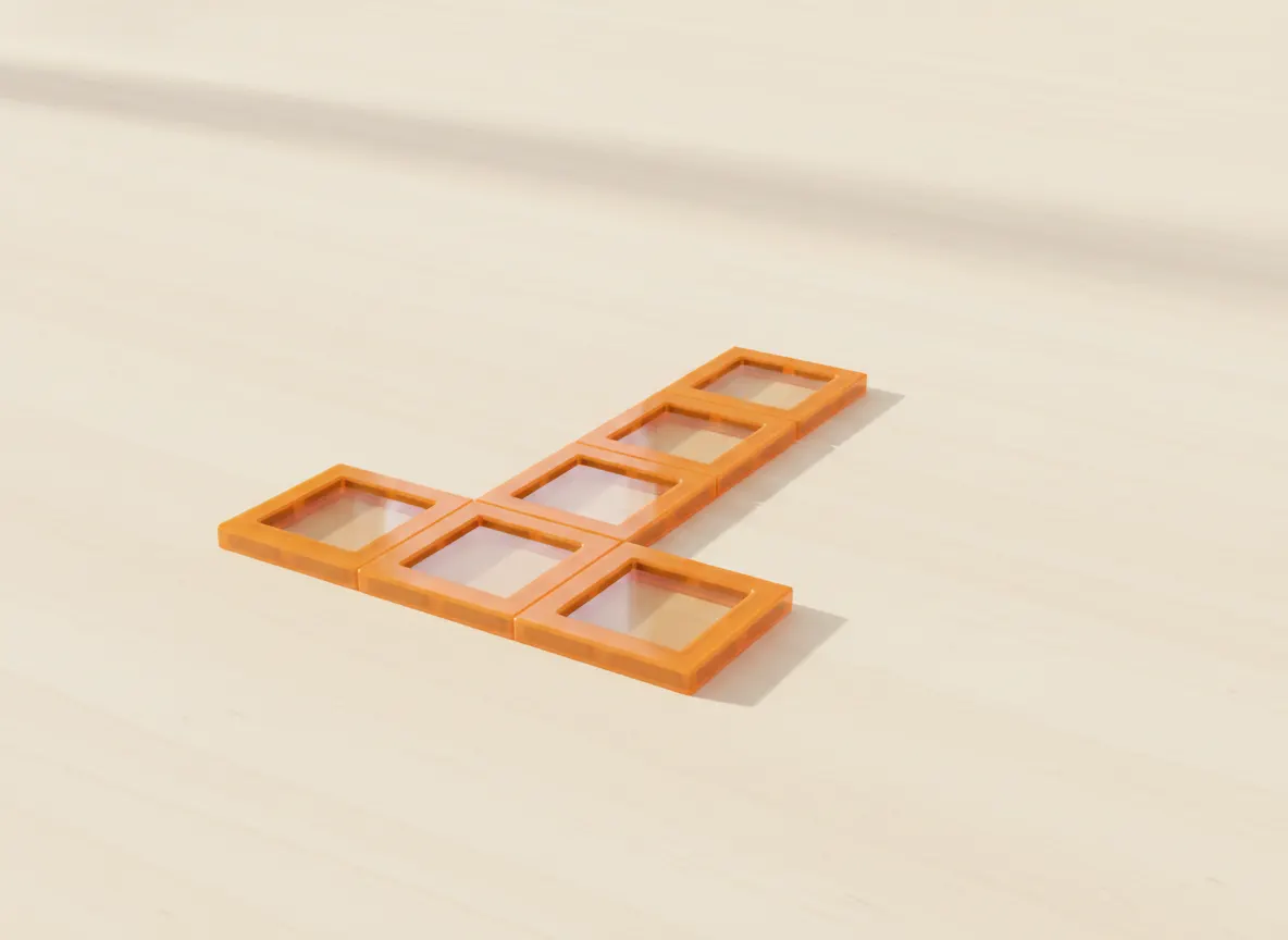 A render of chunky letter t built from translucent magnetic tiles